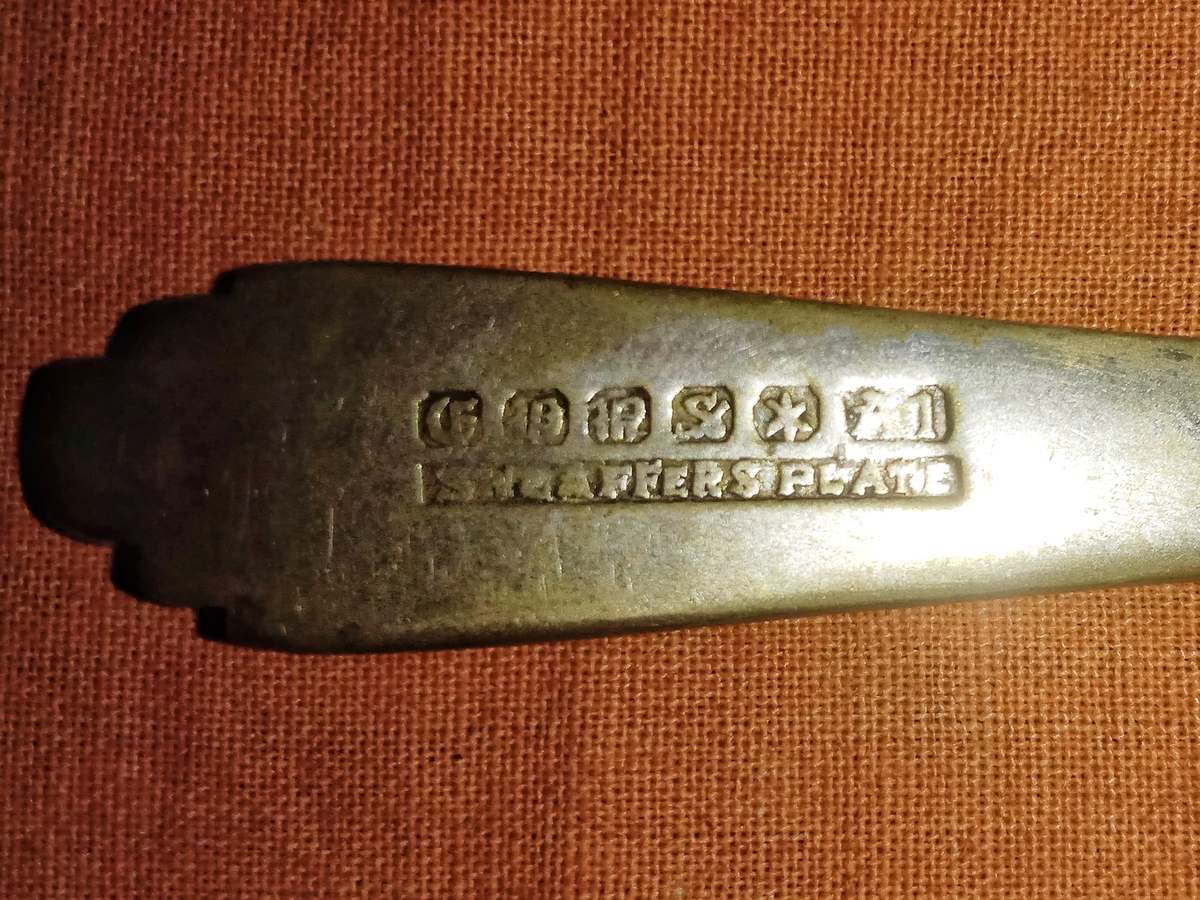 Assay hallmarks struck into the back of an antique silver spoon